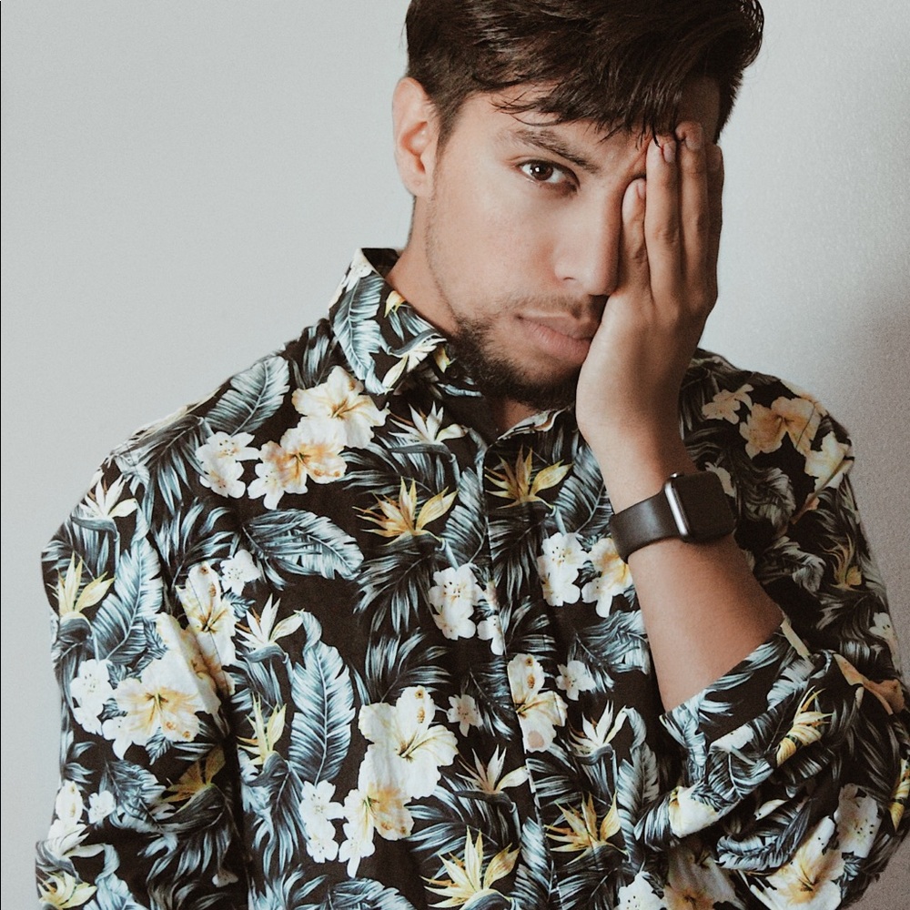 An H&M floral button-up medium shirt.